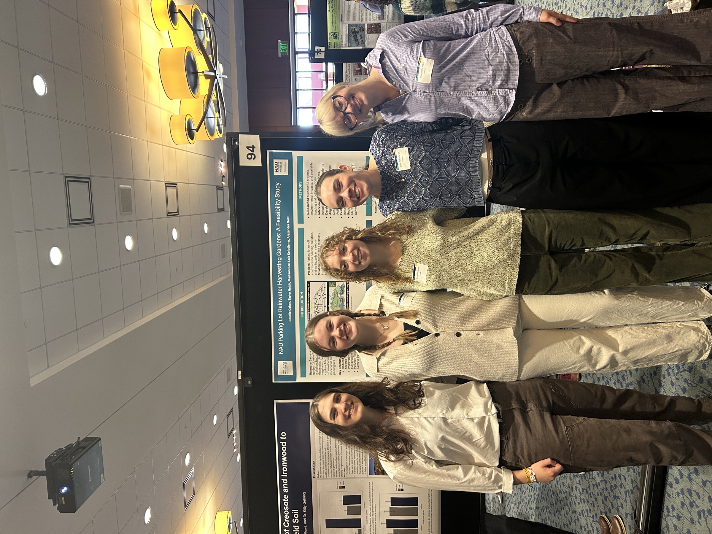 Rainwater diversion team with poster